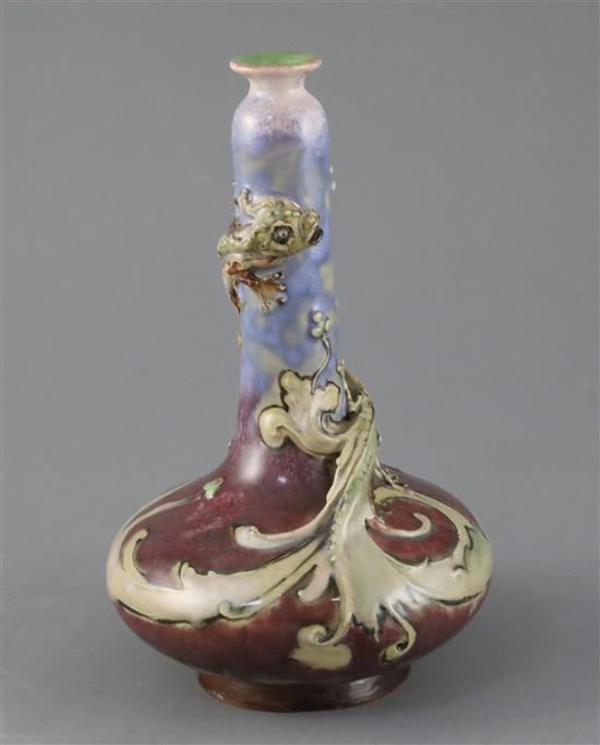 Mark V Marshall for Doulton lambeth, a flambe bottle vase entwined by a mythical beast, c.1885, 19cm, restored